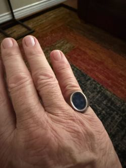 1 silver ring with blue stone & men’s band ring