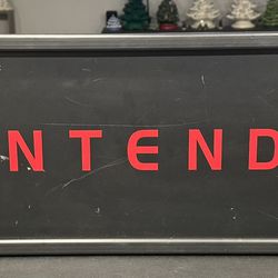Vintage Lighted Nintendo sign. 27” x 12” corded with on/off switch. Vintage display sign from old video game store. Light works good.