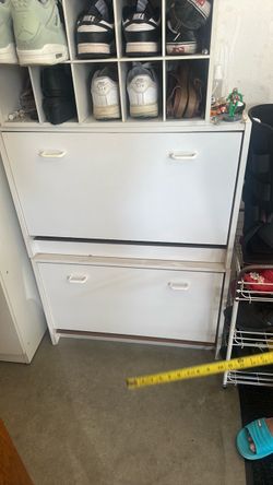 White wooden shoe cabinets