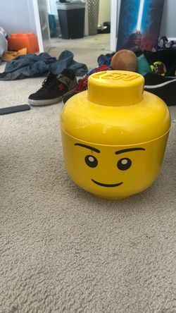 Lego minifigure head storage container and assorted legos