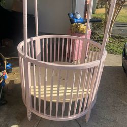Used Pink Circular Crib (no Screws Missing Canopy And No Mattress)