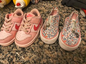 Pink Nikes in floral slip on