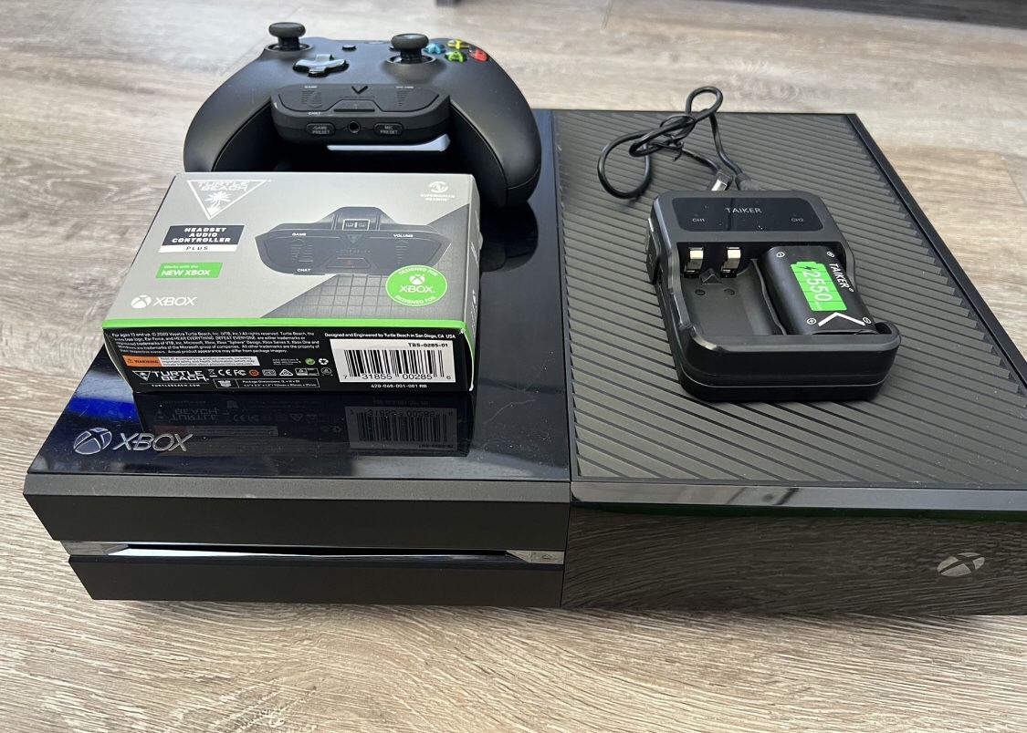 Xbox one perfect working condition with 10 games, 2 controllers, 3 rechargeable batteries , headset, and a turtle beach headset audio controller.