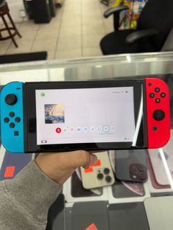 Excellent condition Nintendo Switch 64GB with Red & Blue Joycon