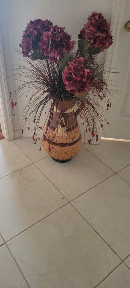 large vase with fake flowers