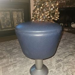 10 pieces
a modern stool with a blue faux leather seat on a metal base.