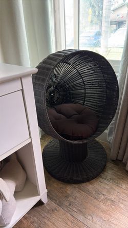 The Refined Feline brown egg wicker elevated cat chair/bed with cushion