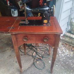 Vintage Sewing Machine And Cabinet