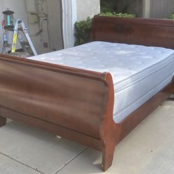 Full size sleigh bed in good condition, Solid wood, very sturdy