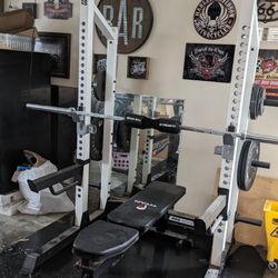 At Home GYM equipment set up. 
Comes with Weights (Adds total to 165LB) and Olympic size Bar