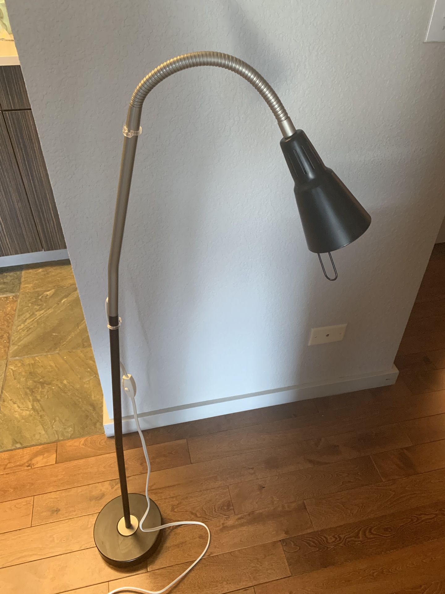 Ikea Tall Floor Lamp with an adjustable neck