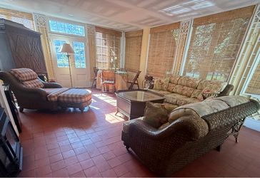 Full room of wicker sunroom furniture