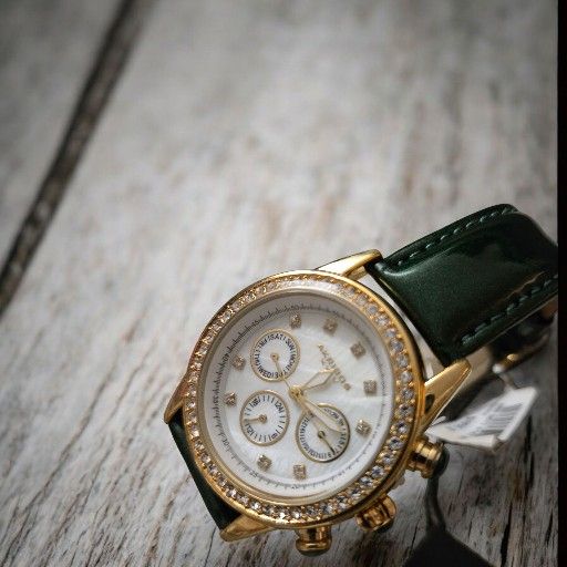 Akribos XXIV Ladies Sparkling Crystal Date Green Leather 