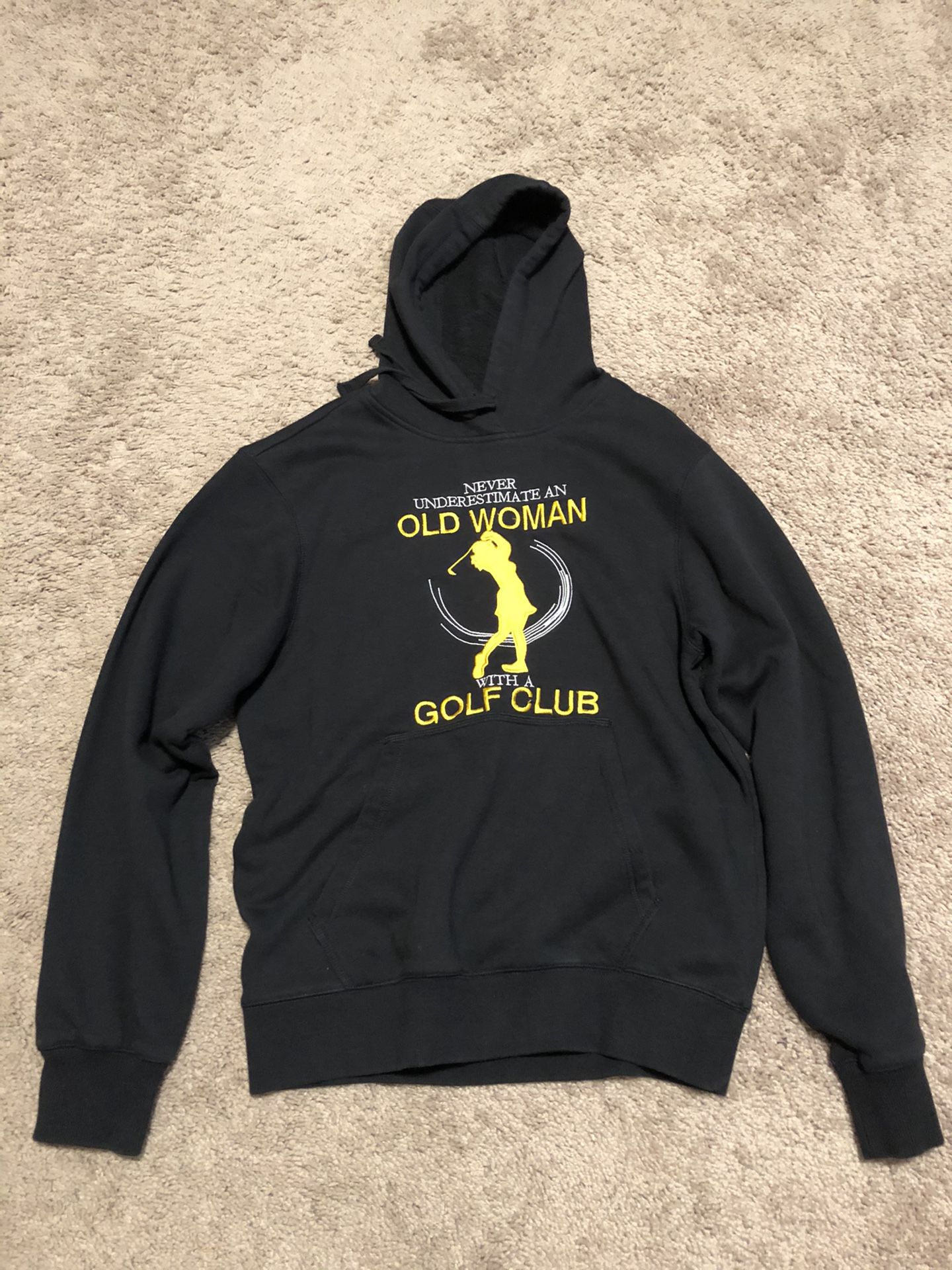 Ladies hooded sweatshirt . “Never Underestimate an Old Woman with a Golf Club”