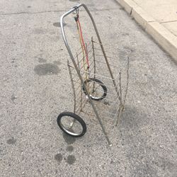 A GROCERY SHOPPING CART /LAUNDRY CART WITH TWO BUNGEE CORDS LITE WEIGHT AND STURDY FOLDS FLAT USED IN GOOD CONDITION $20.00