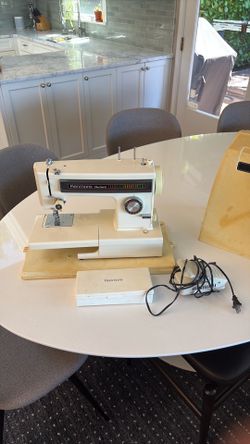 Kenmore sewing machine with accessories