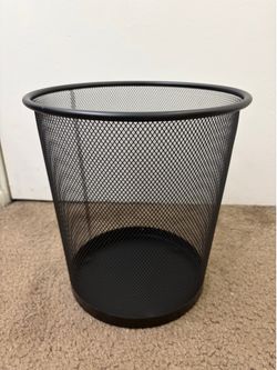 Black mesh round trash can.