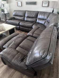 Sectional grey leather couch with end recliners