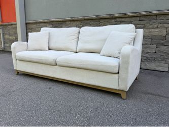 Cream sofa with pillows