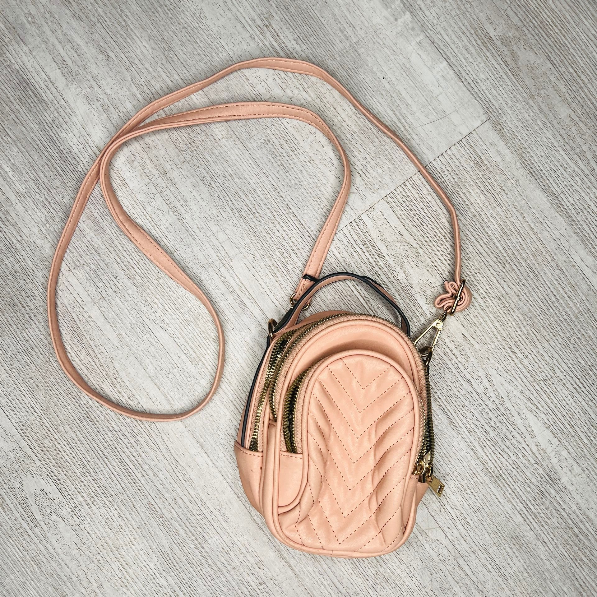 Pink mini Purse with gold zipper and accents.