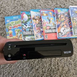 Wii U With Games And Controllers And Wires. 
