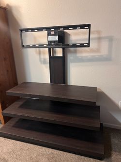 Entertainment center with built in tv holder