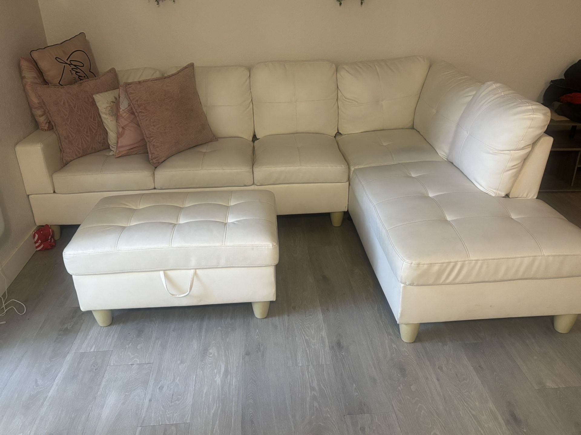 white sectional and ottoman