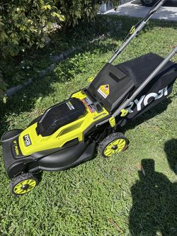 NEW OPEN BOX RYOBI 16 INCHES 18 V BRUSHLESS PUSH LAWNMOWER IS AN ORIGINALBOX INCLUDES TWO 2Am LITHIUM BATTERIES WITH FAST  CHARGER GRASS CATCHER. IT'S