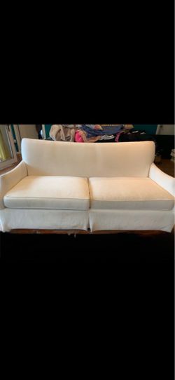 White Two- cushion Slip cover sofa