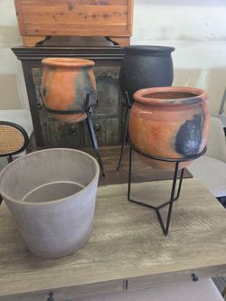 3 antique terracotta pots with stands and 1 new gray pot