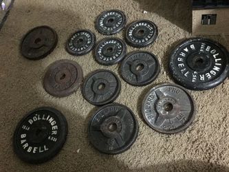 Standard barbell and curl bar with 112lbs of Various weight plates