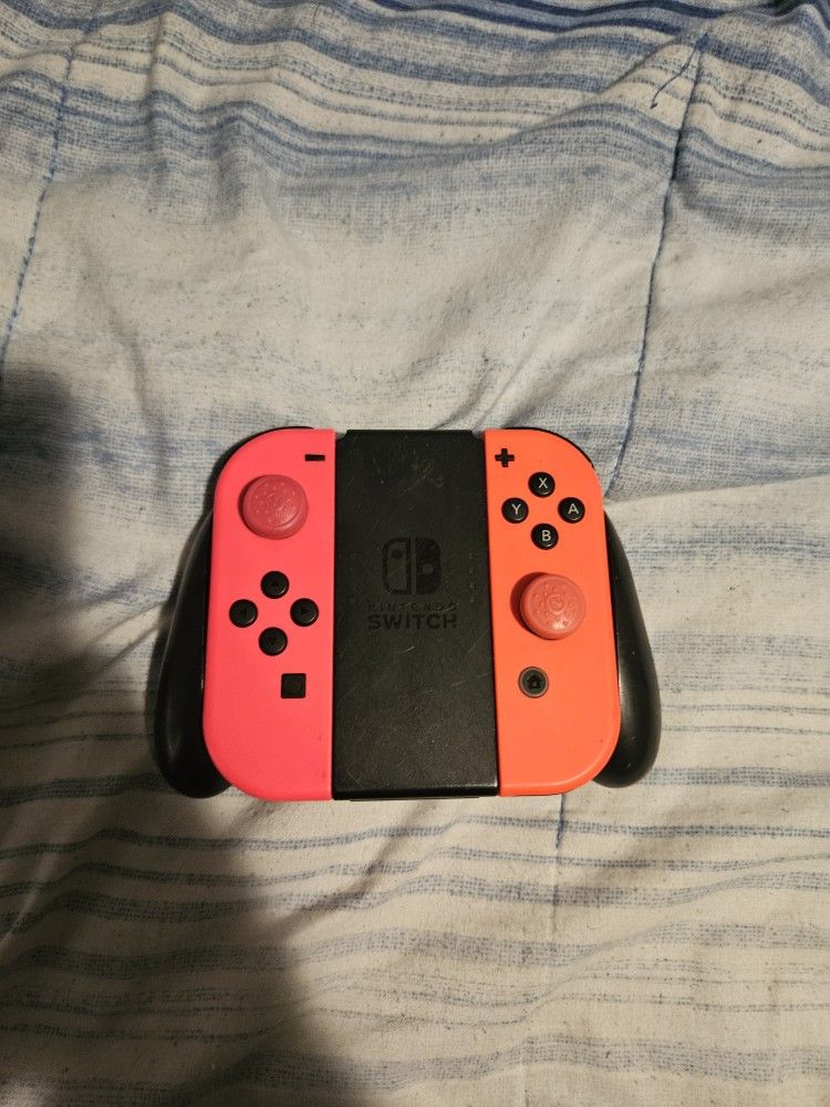 Nintendo Switch Joycons Pink And Orange 