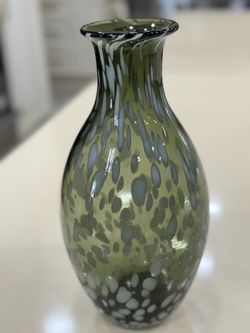 Juliska Puro 12.5 inch vase features a green glass body with a white tortoiseshell pattern.