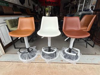 Brand new adjustable height Real leather swivel Bar stools only $110 each