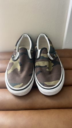 Vans Classic Slip-On sneakers in a "Woodland Camo" colorway