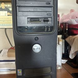 Dell Dimension 3100 (aka Dimension E310) desktop tower with an Intel Pentium 4 HT sticker and a Windows XP COA.