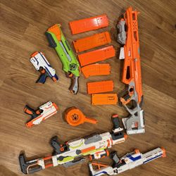 Nerf Guns + Lots Of Bullets 