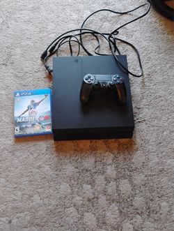 PS4 with controller and game