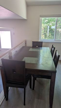 Dark Brown Dining table with 4 chairs and a bench