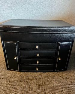 2 separate jewelry boxes