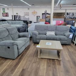 Reclining Sofa And Loveseat In Grey 