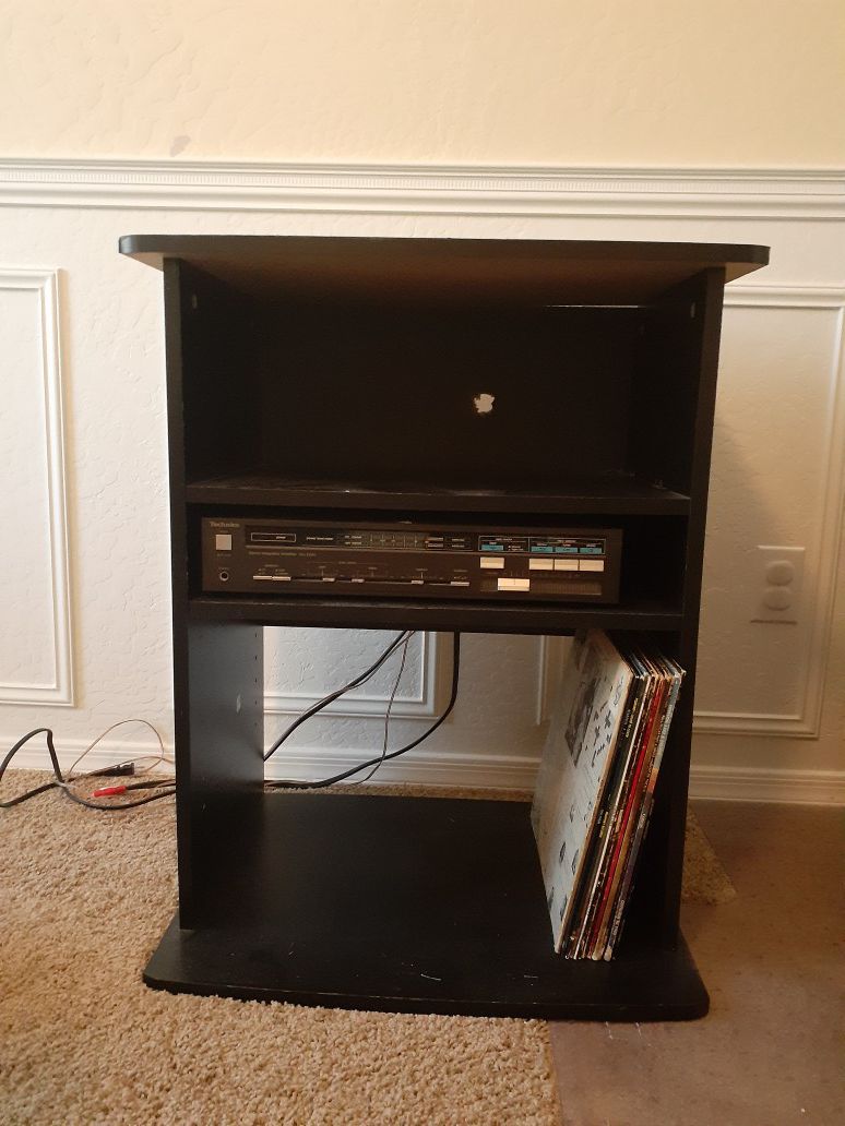 Media stand, holds stereo, amplifier, records used for turntables, dj stand