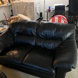 Matching leather Sofa and Captains Chair with footrest