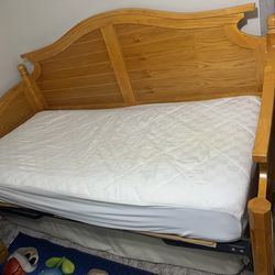 Wooden twin size bay bed with mattress.