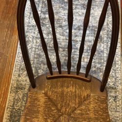 Antique Wooden Chair With Caned Seat.