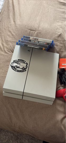 White Sony PS4 Console with Games and Controller