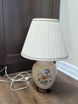 Small vintage lamp with vintage floral painted pattern.
