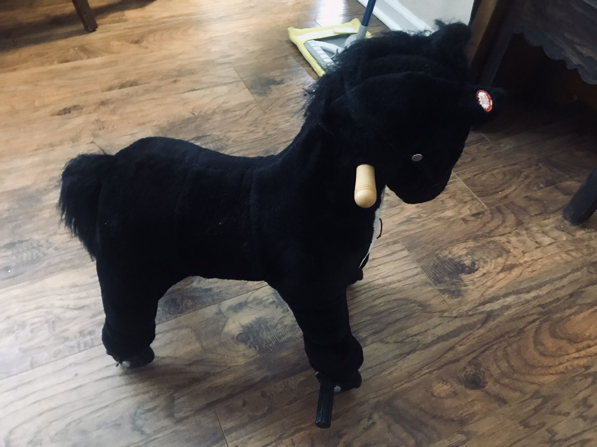 Rolling Black and White lifelike Horse for small child.