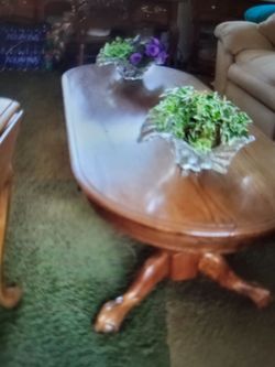 Oak coffee table claw feet perfect. Very heavy, two in tables oak. They fold down on each side. All are perfect