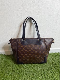 Louis Vuitton monogram canvas tote handbag with dark leather trim and gold-tone hardware.